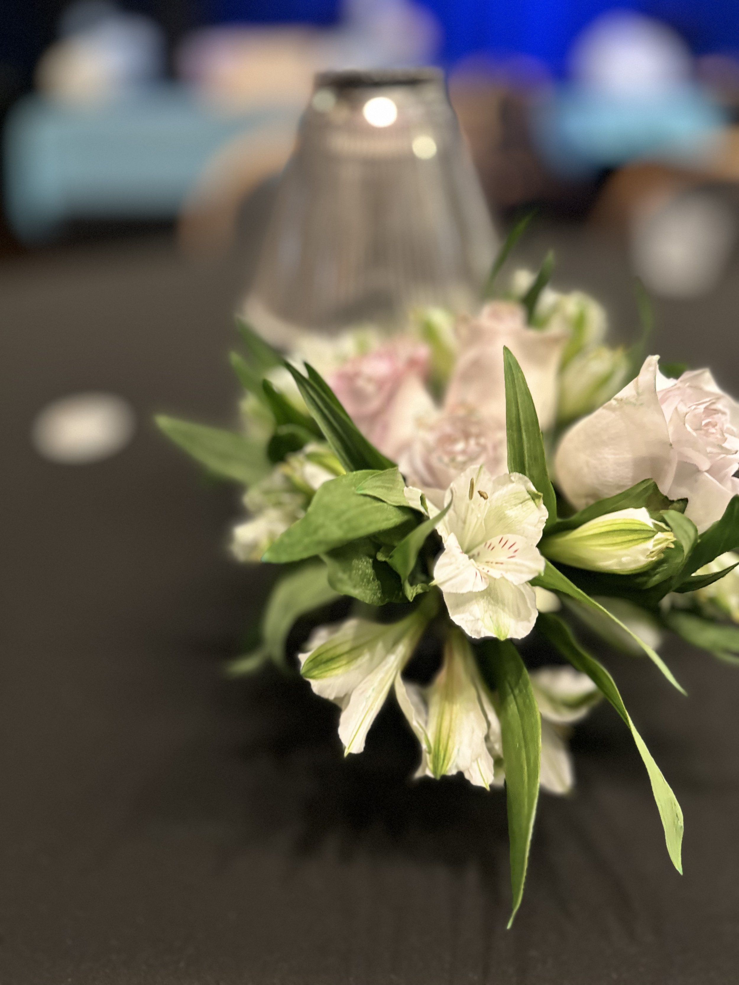 Event table setup with flower centerpiece